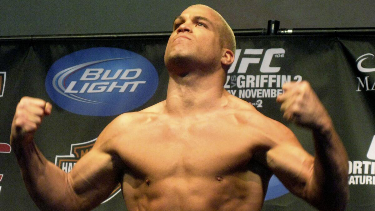 Former UFC light-heavyweight champion Tito Ortiz weighs in for his UFC 106 fight in 2009.