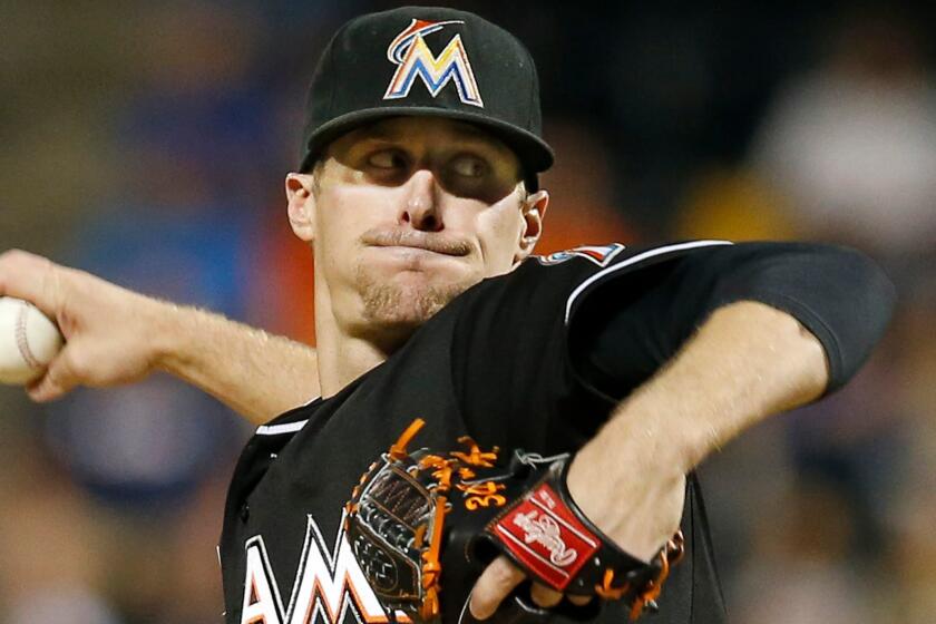 Miami Marlins starting pitcher Tom Koehler winds up in the first inning of a baseball game against the New York Mets in New York, Tuesday, Sept. 15, 2015. (AP Photo/Kathy Willens) ORG XMIT: OTKKW101