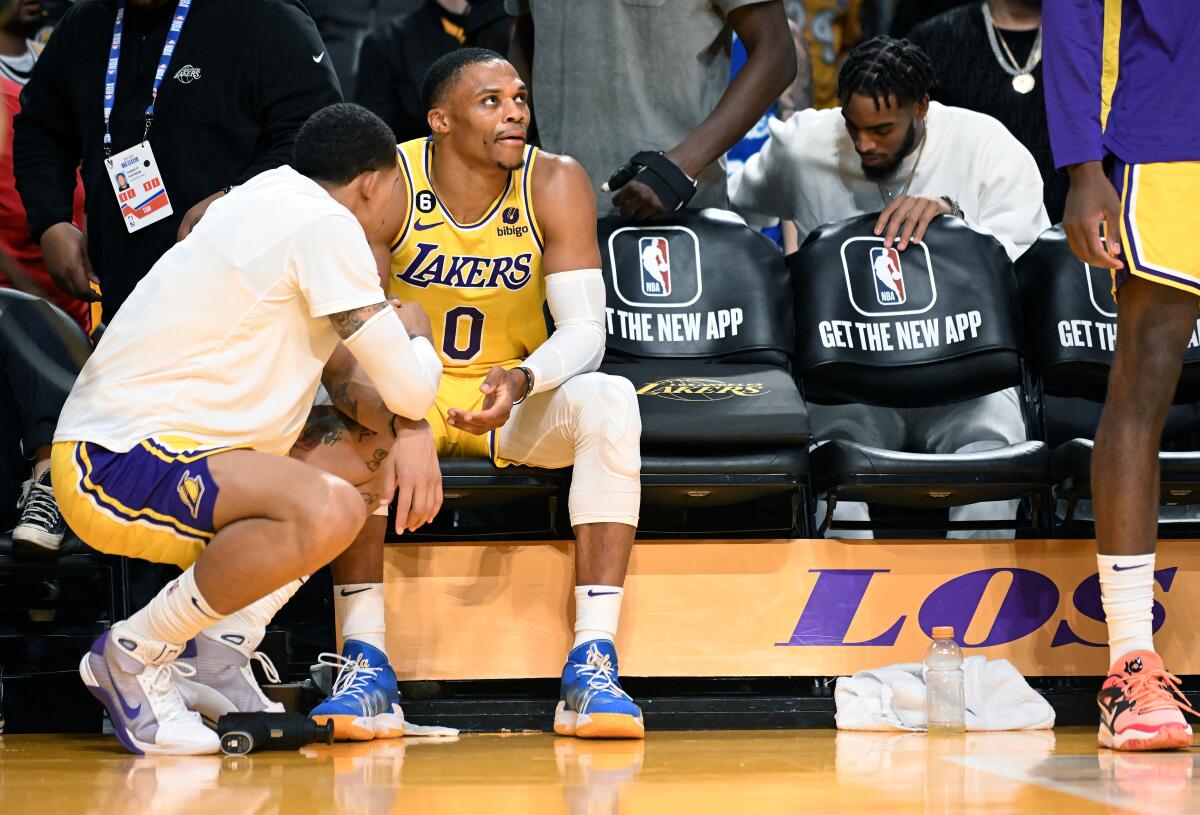 Lakers guard Russell Westbrook sits on the bench after being pulled from the game.