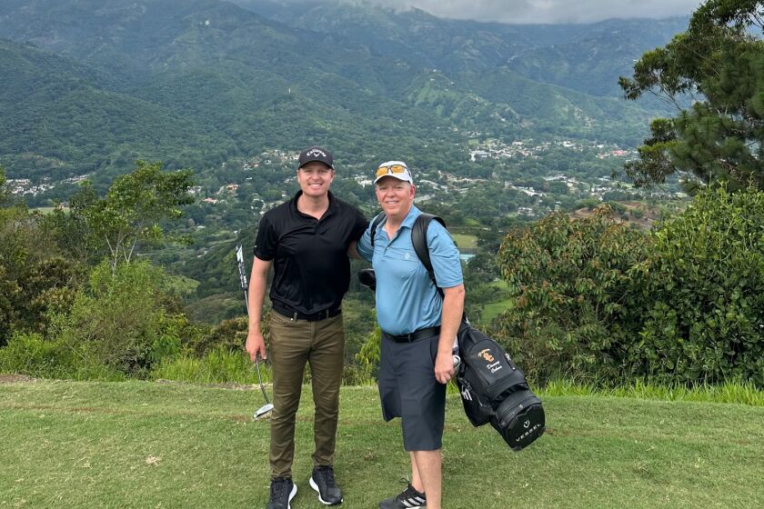 Danny Ochoa and Herb Morgan on the course in Colombia.