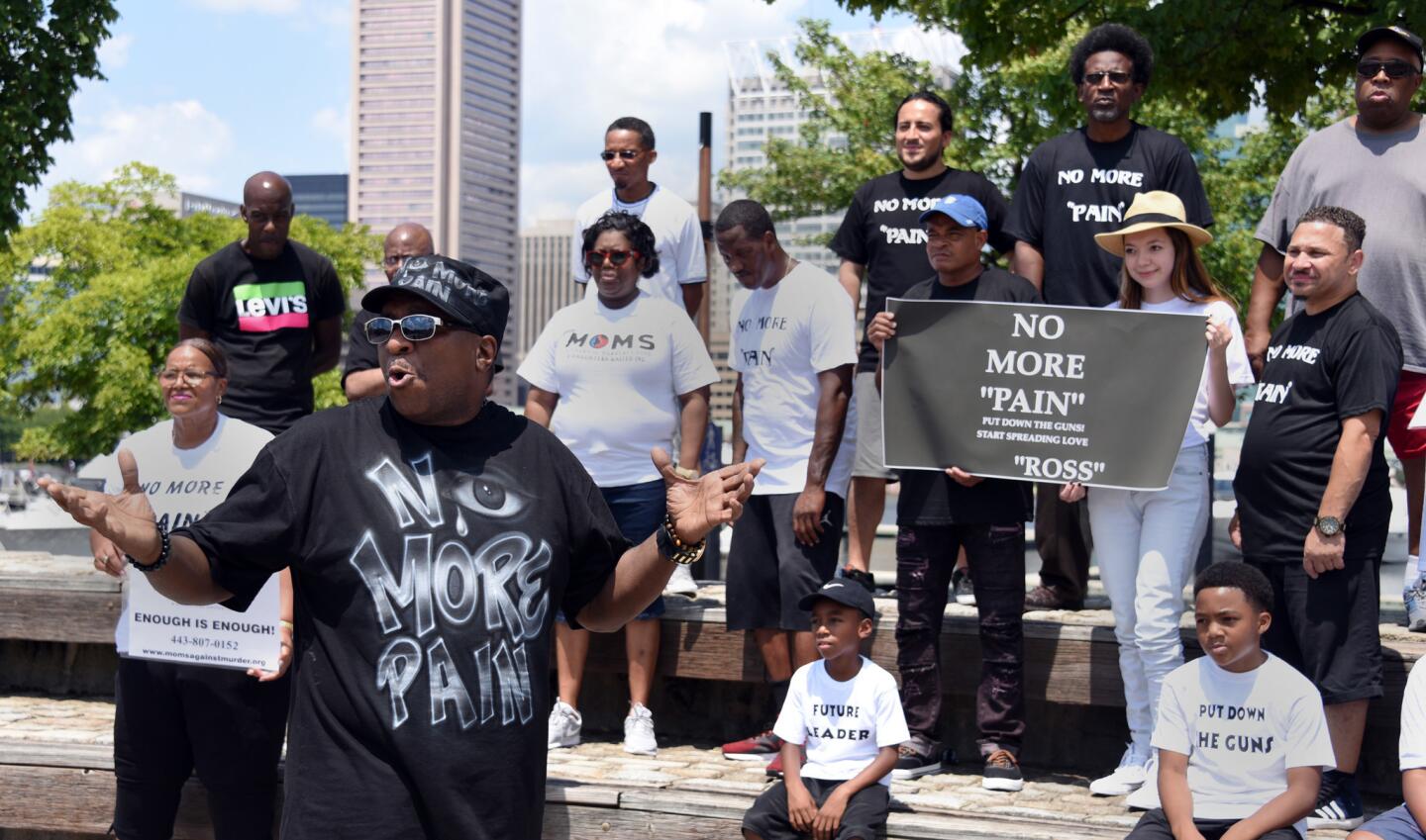Baltimore singer Ross films a video for his song "No More Pain" at the Inner Harbor this afternoon. Members of the public were invited to participate.