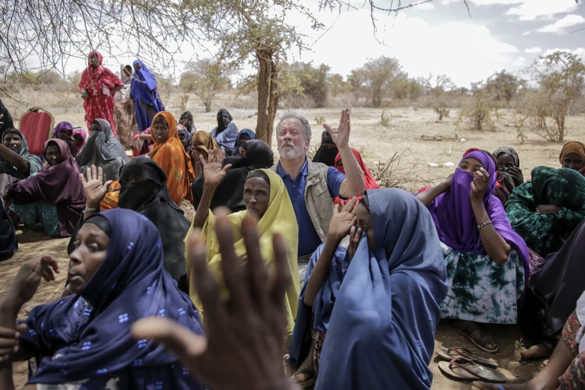 World Food Program chief David Beasley meets with villagers in northern Kenya on Friday.