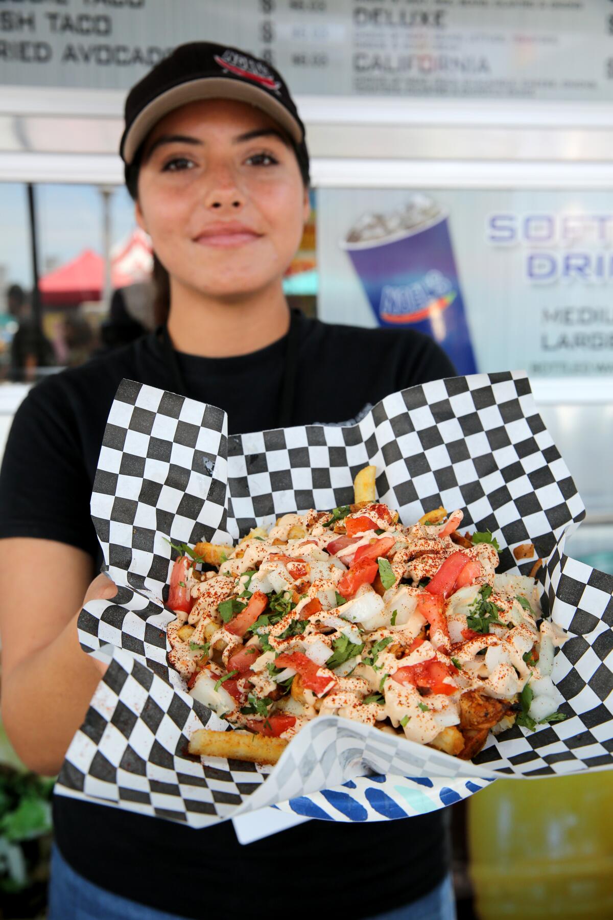 Yaqui from Noel's Mexican Food shows the chicken chipotle fries.