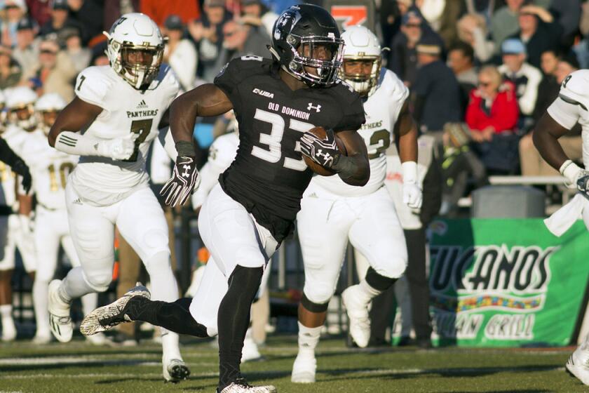 Old Dominion's Ray Lawry runs for a touchdown in the first half against Florida International on Nov. 26. Lawry ran for 133 yards against Eastern Michigan in the Bahamas Bowl.