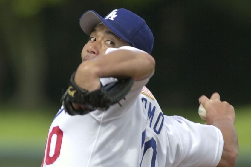 Los Angeles Dodgers' Hideo Nomo warms up before pitching against the Florida Marlins Sunday March 3, 2002 in Vero Beach, Fla. The Dodgers defeated the Marlins 9–8.(AP Photo/M. Spencer Green)