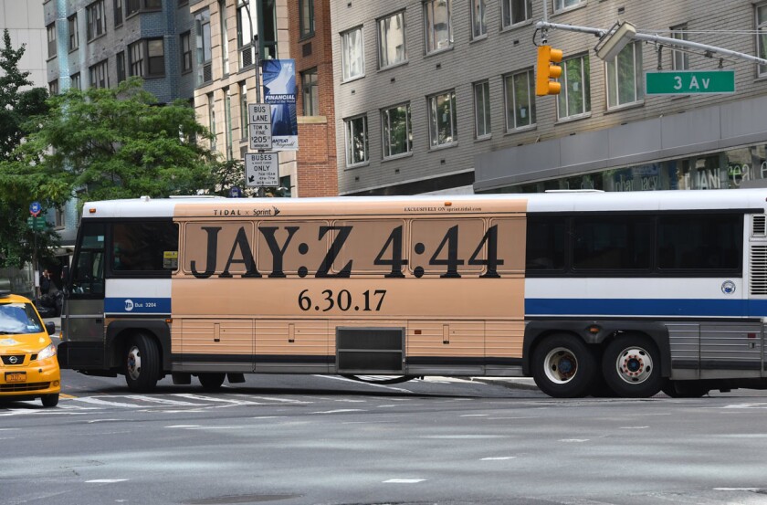 In this photo taken June 26, 2017, a New York City bus with an advertisement for Jay-Z's anticipated new album "4:44" turns a corner in midtown New York City. (Getty Images)