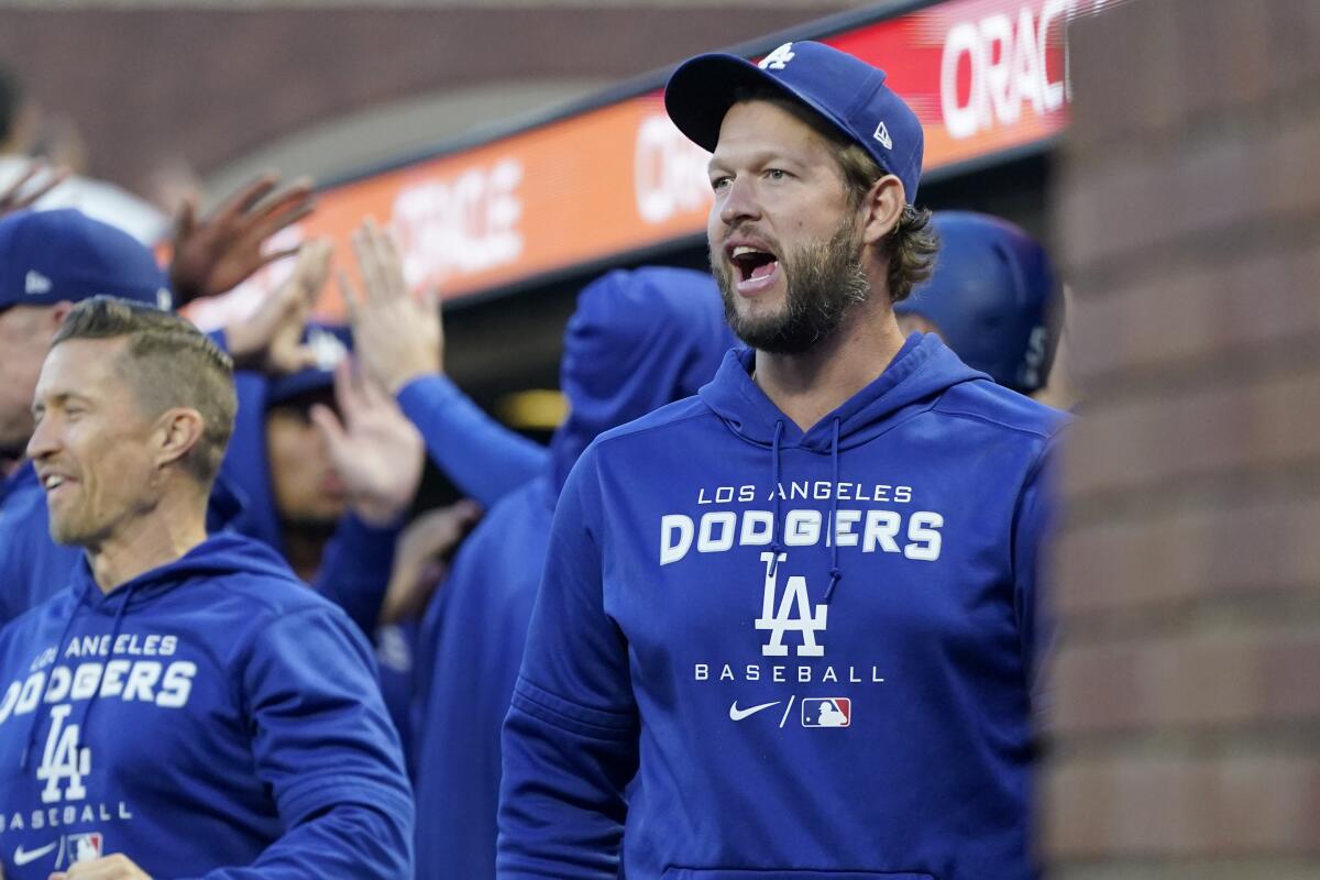 Clayton Kershaw looks on from the dugout.