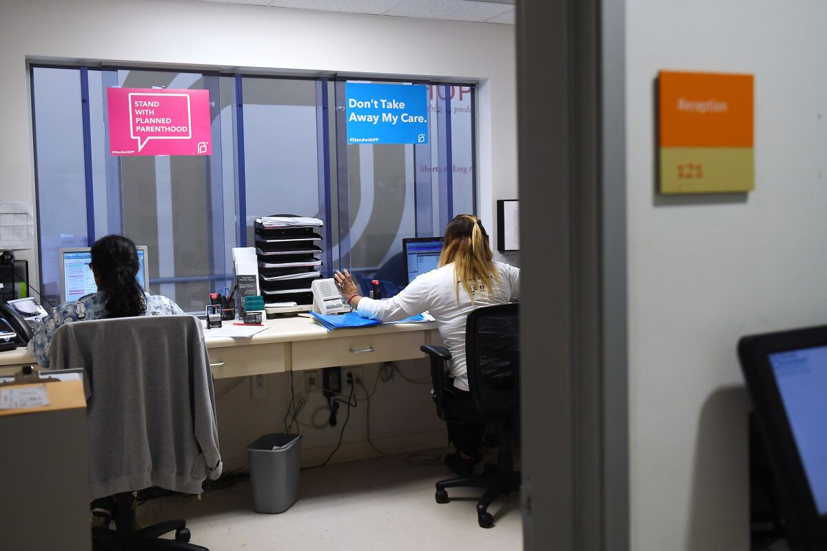 Employees work in the front office at Planned Parenthood in Los Angeles.