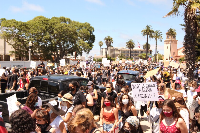 Demonstrators march in La Jolla in support of the Black Lives Matter movement June 12.