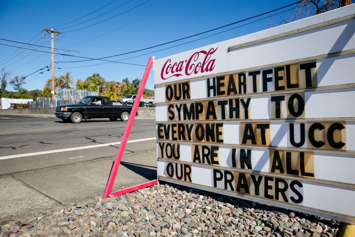 Signs of support are posted in Roseburg, Ore.