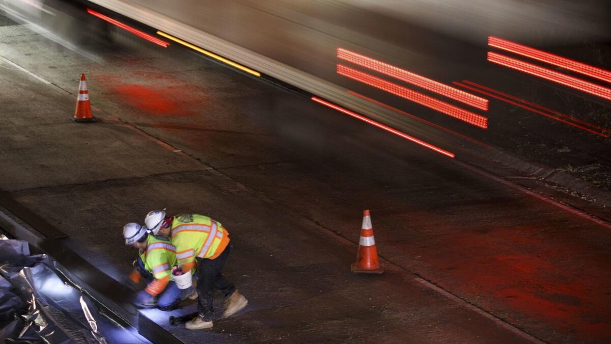 Contractors work on the 101 Freeway in the San Fernando Valley in 2017.
