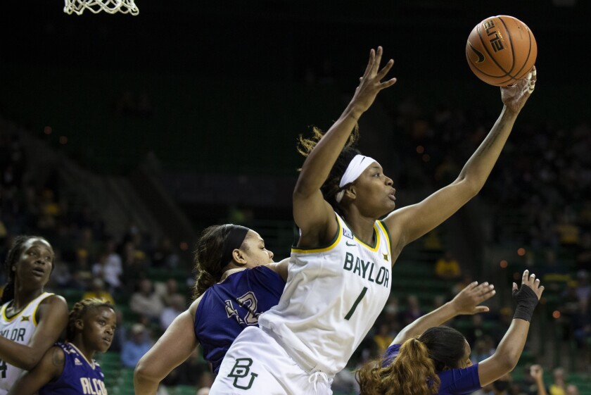 Baylor forward NaLyssa Smith (1) leaps to grab a rebound over Alcorn State center Bria Broughton (42) in the first half of an NCAA college basketball game in Waco, Texas, Wednesday, Dec. 8, 2021. (AP Photo/Emil Lippe)