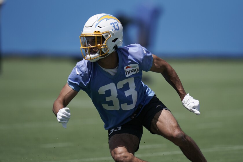 Chargers safety Deane Leonard conducts a drill during practice in June.