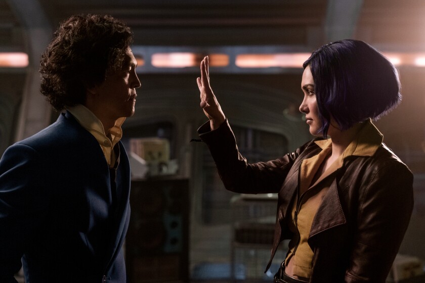 Daniella Pineda holds her hand up to John Cho on "Cowboy Bebop."