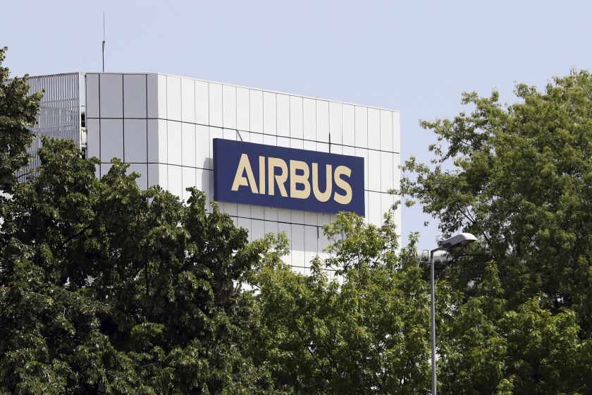 FILE - The logo of Airbus group is displayed in Toulouse, south of France, on July 9, 2020. A Paris court on Wednesday Nov. 30, 2022 approved an agreement under which Airbus will pay a 15.8 million euro ($16.3 million) fine to end a corruption probe focusing on sales to Libya and Kazakhstan over a decade ago, French financial prosecutors said. (AP Photo/Manuel Blondeau, File)