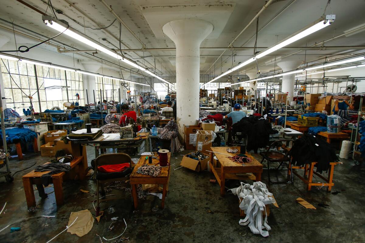Workers at sewing machines in a garment factory in Los Angeles. 