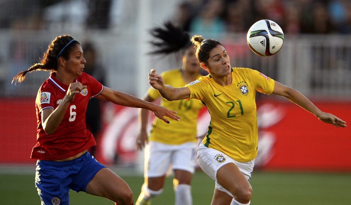 Costa Rica's Carol Sanchez, left, and Brazil's Gabi Zanotti race for the ball during the FIFA Women's World Cup 2015 match on Wednesday.