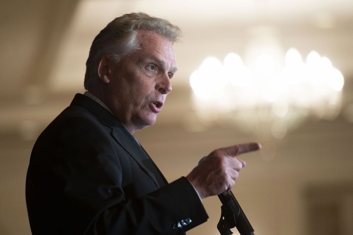 FILE - In this Sept. 1, 2021, file photo, Virginia Democratic gubernatorial candidate Terry McAuliffe addresses the Virginia FREE Leadership Luncheon in McLean, Va. McAuliffe on Tuesday called on leaders in Washington from both parties — including President Joe Biden — to “get their act together," while pushing Senate Democrats to scrap the filibuster if needed to enact the party's priorities on infrastructure spending and voting rights. (AP Photo/Cliff Owen, File)