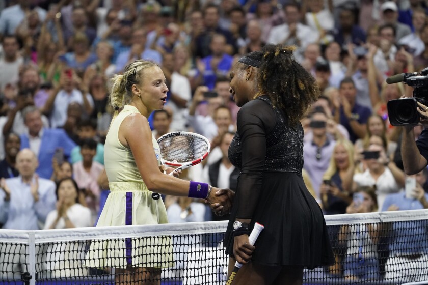 Serena Williams shakes hands with Anett Kontaveit.