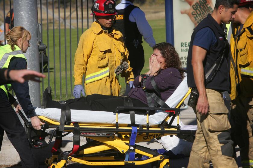 A victim is wheeled away on a stretcher following a shooting that killed multiple people at a social services facility, Wednesday, Dec. 2, 2015, in San Bernardino, Calif.