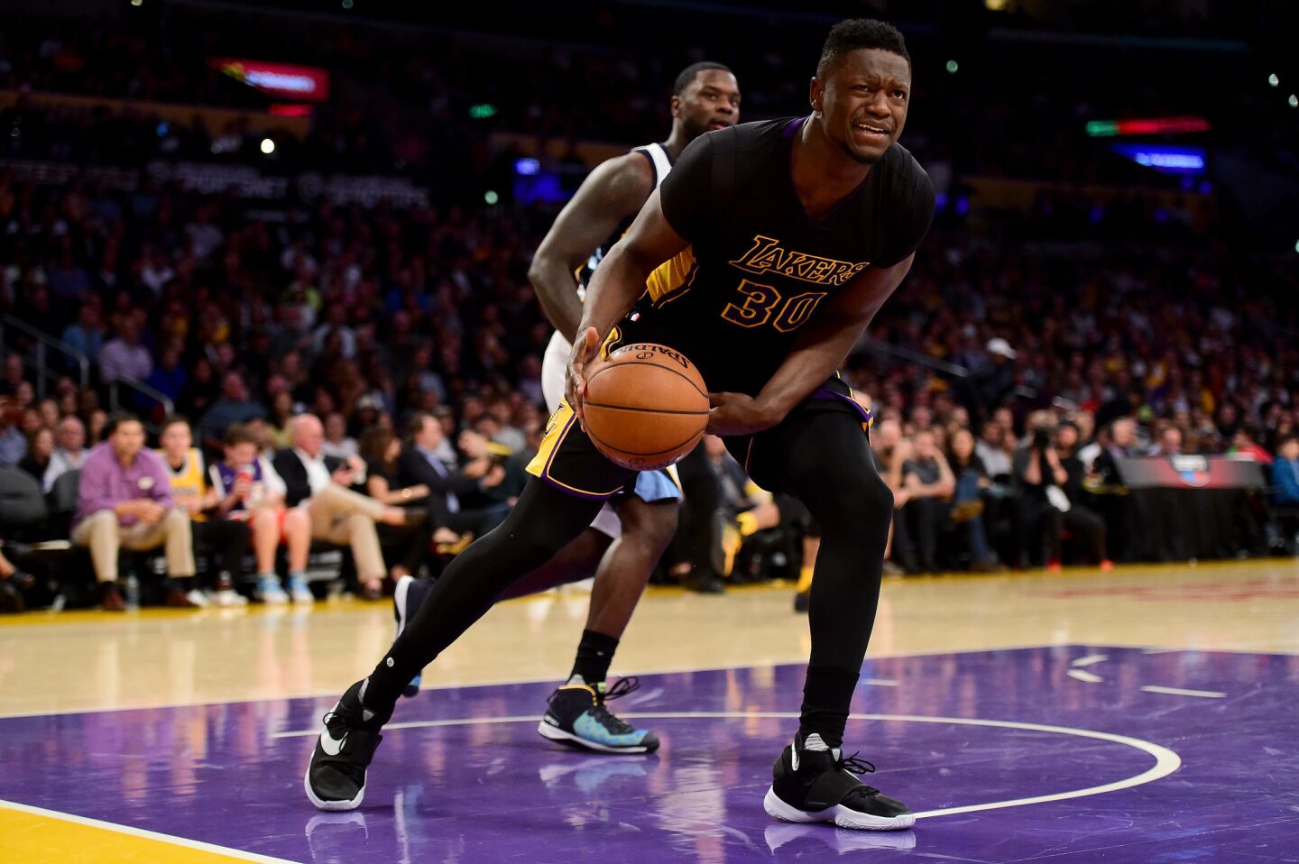Lakers forward Julius Randle reacts as he is fouled during a game against the Grizzlies on Feb. 26 at Staples Center.