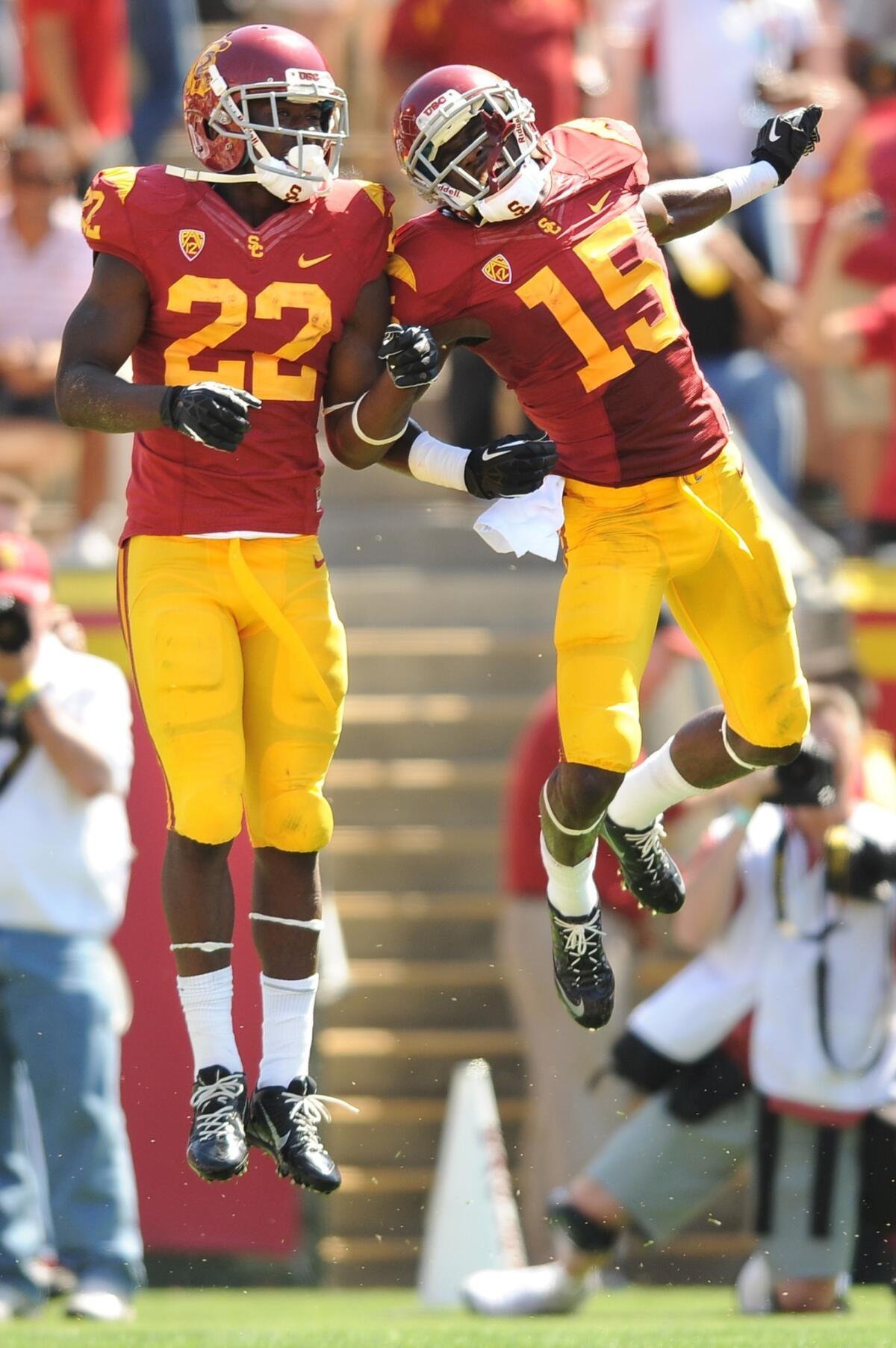 USC running back Justin Davis, left, celebrates with teammate Nelson Agholor after scoring a touchdown in Saturday's 35-7 win over Boston College.