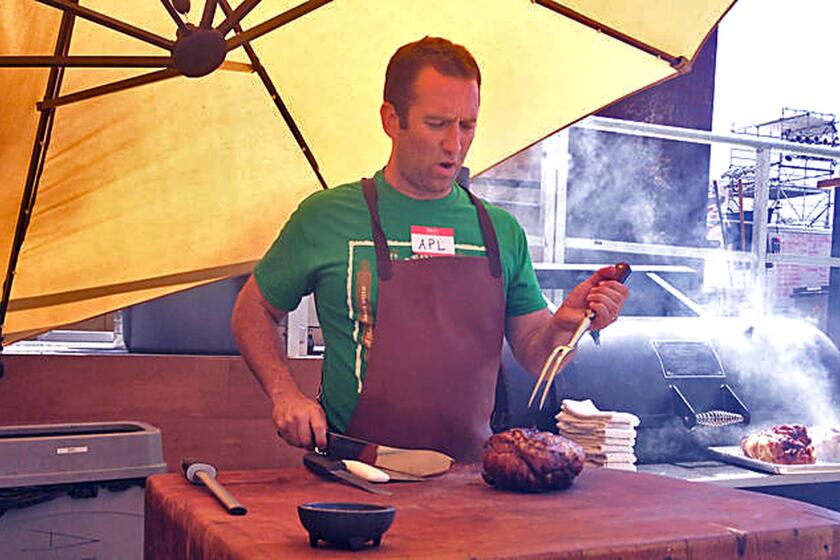 Adam Perry Lang cooks in a parking lot behind the El Capitan Theatre in Hollywood.