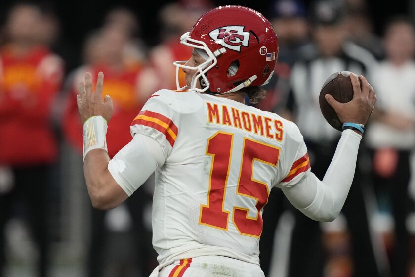 FILE - Kansas City Chiefs quarterback Patrick Mahomes (15) throws against the Las Vegas Raiders during the first half of an NFL football game, Wednesday, Jan. 11, 2023, in Las Vegas. The Chiefs and Eagles are bringing MVP finalists Patrick Mahomes and Jalen Hurts to the Super Bowl to cap a season in which the NFL had a glaring amount of instability at quarterback.(AP Photo/John Locher, File)