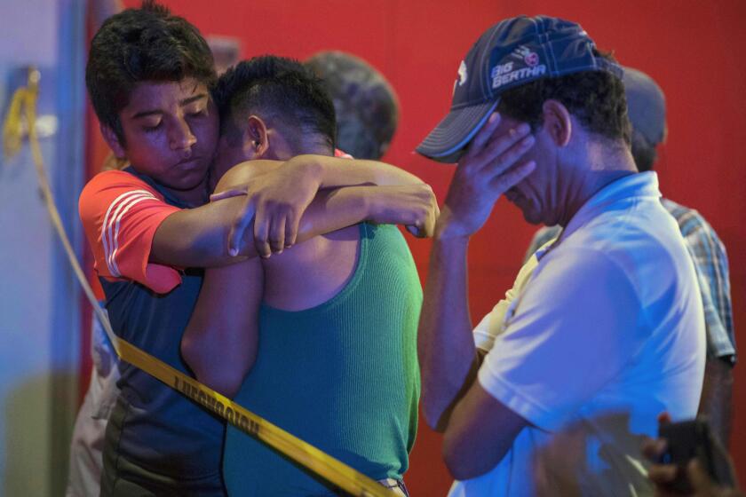 People react outside a bar where 23 people were killed by a fire in Coatzacoalcos, Veracruz on August 28, 2019. - At least 23 people were killed and 13 badly wounded in a fire at Caballo Blanco bar (White Horse bar) in eastern Mexico that is being investigated as an attack according to Mexican authorities. (Photo by ANGEL HERNANDEZ / AFP)ANGEL HERNANDEZ/AFP/Getty Images ** OUTS - ELSENT, FPG, CM - OUTS * NM, PH, VA if sourced by CT, LA or MoD **