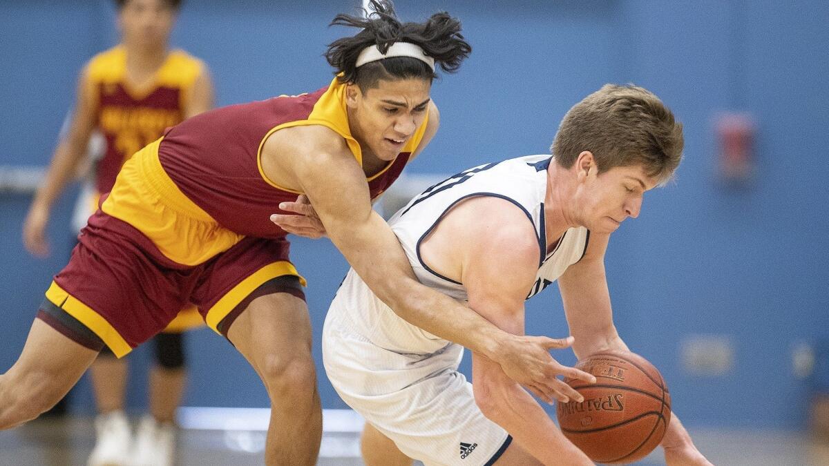 Newport Harbor High's Will Harvey scrambles for a loose ball with Riverside Hillcrest's Sebastian Mendoza during a Coach Mike's Long Shot Challenge game on Monday.