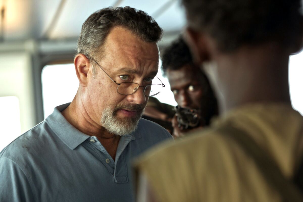 A bearded man in glasses in the movie "Captain Phillips."