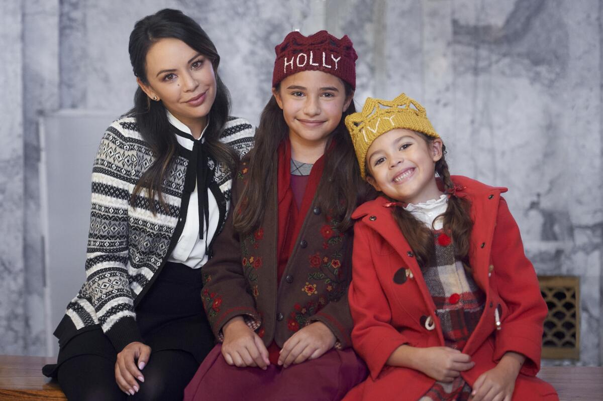 Sadie Coleman (center) stars in "Holly & Ivy" with Janel Parrish and Piper Rubio.