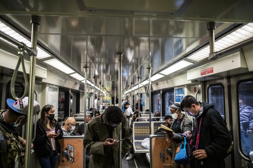 People ride an L.A. Metro train