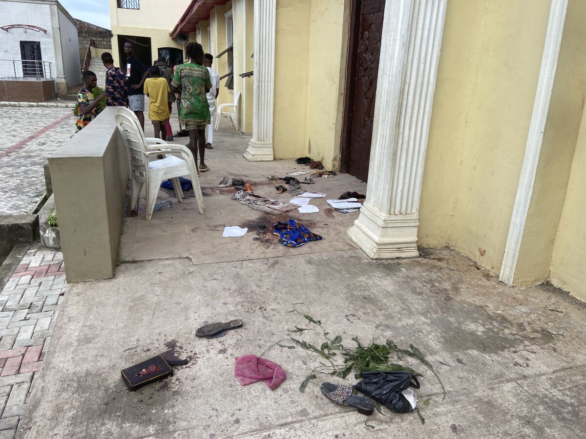 People's belongings strewn outside a church that was attacked by gunmen
