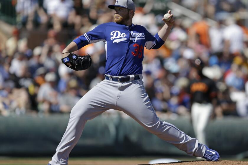 Dodgers left-handed pitcher Brett Anderson delivers a pitch in the first inning of a spring training exhibition game.