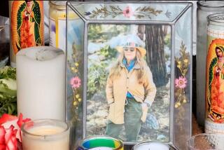 A photo of Mag.pi owner Laura Ann Carleton is placed among the candles outside the store on Aug. 19, 2023 in Cedar Glen. (ONSCENE.TV)