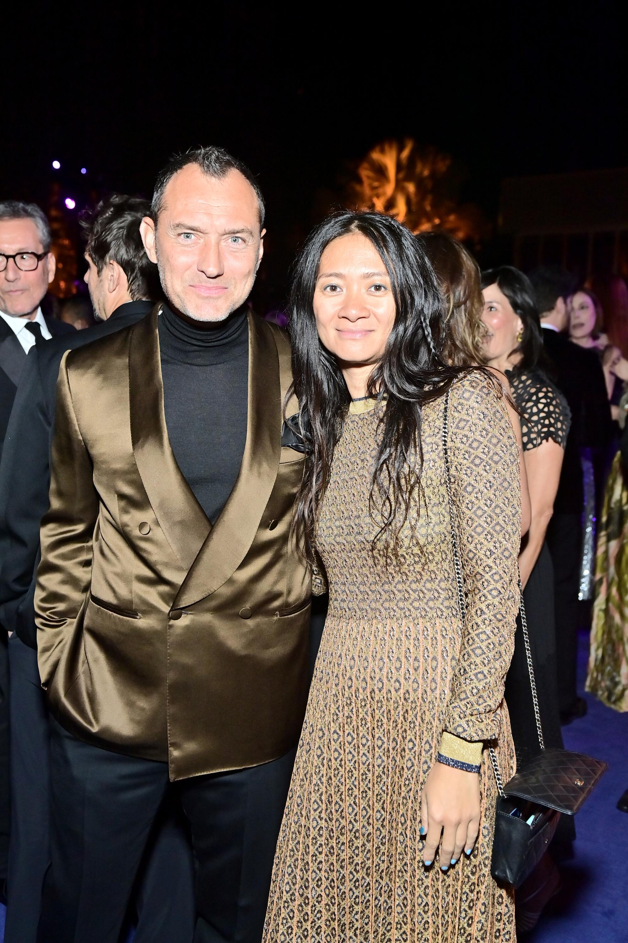 Jude Law and Chloe Zhao in formalwear