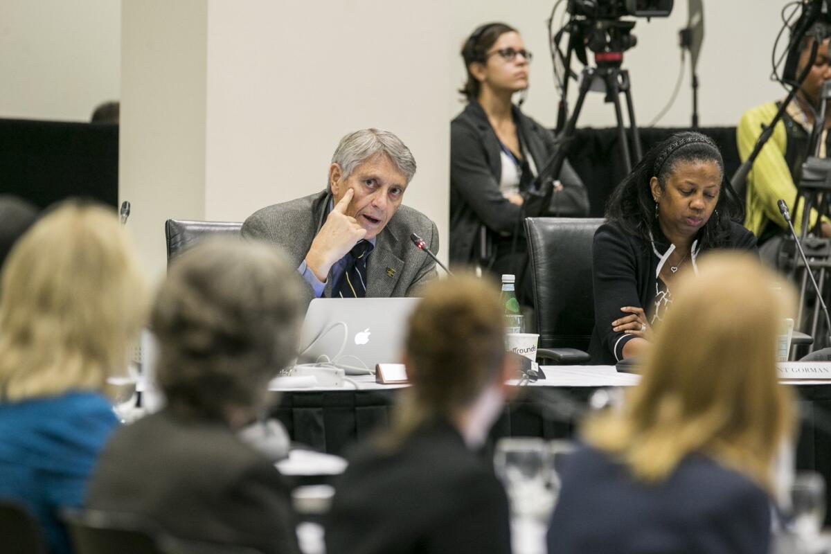 Alumni Regents Rod Davis, left, and Yolanda Gorman address the University of California’s Board of Regents meeting to discuss a controversial policy statement on intolerance at UC Irvine on Sept. 17.