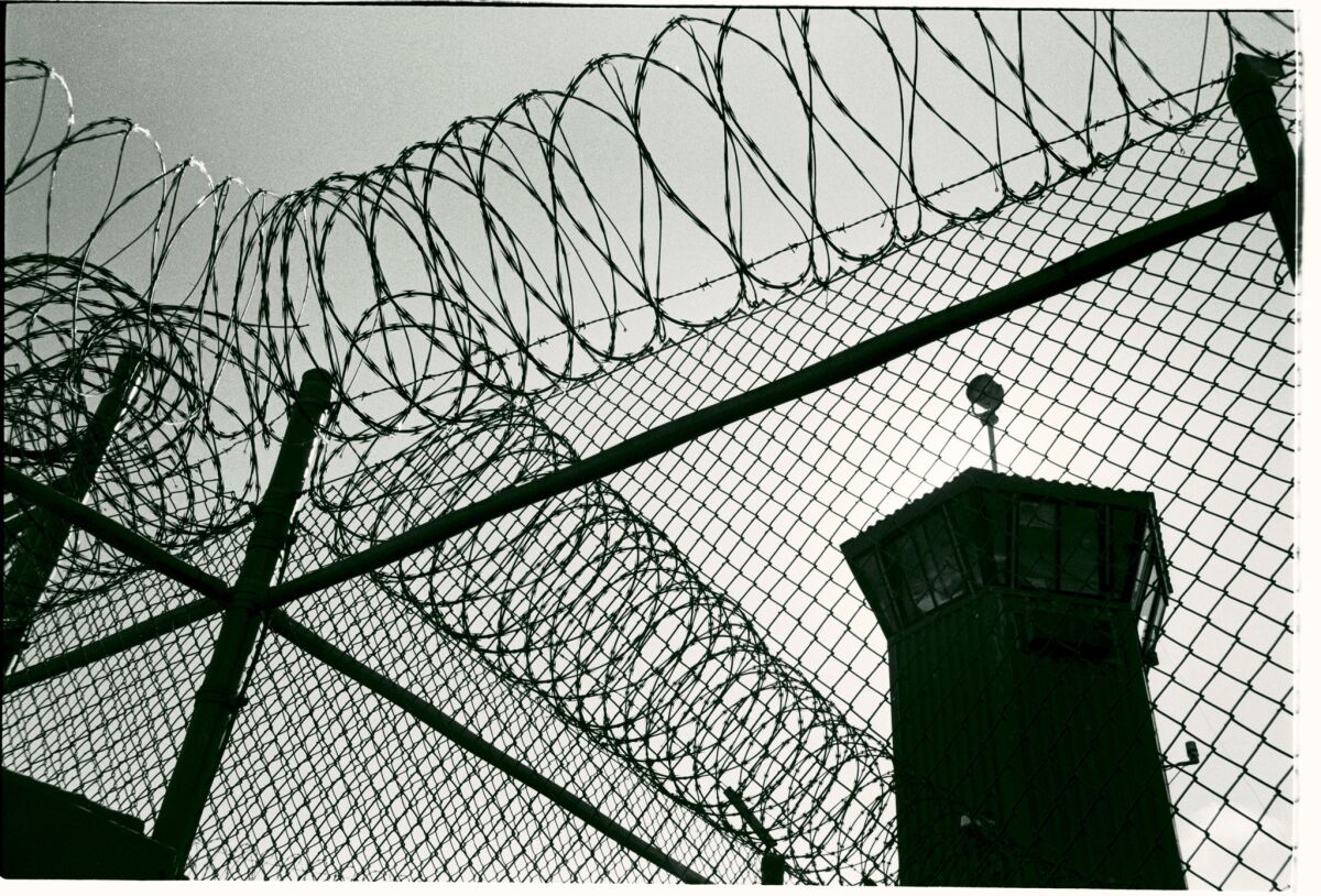 Tall fences and razor wire encircle Pelican Bay State Prison in Crescent City, where some criminal offenders had been held in solitary confinement because of prison gang activity. Under an agreement announced Tuesday, thousands of inmates in solitary will be released into the general prison population.