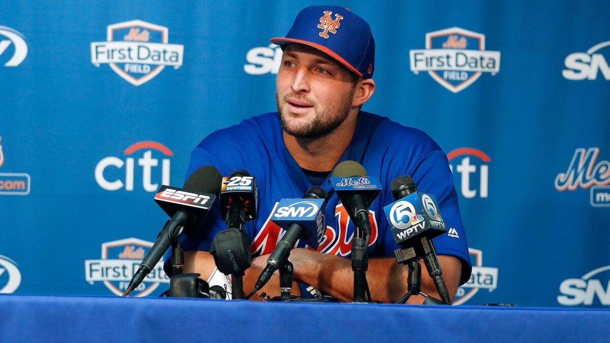 Tim Tebow listens to a question during a news conference at the New York Mets' spring training facility in Port St. Lucie, Fla., on Feb. 27.