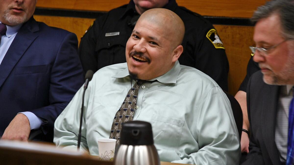 Luis Bracamontes acts out in court during day one of his trial in Sacramento, Calif., Superior Court. Bracamontes, a man in the U.S. illegally, was convicted Friday, Feb. 9, 2018 of killing two Northern California deputies.