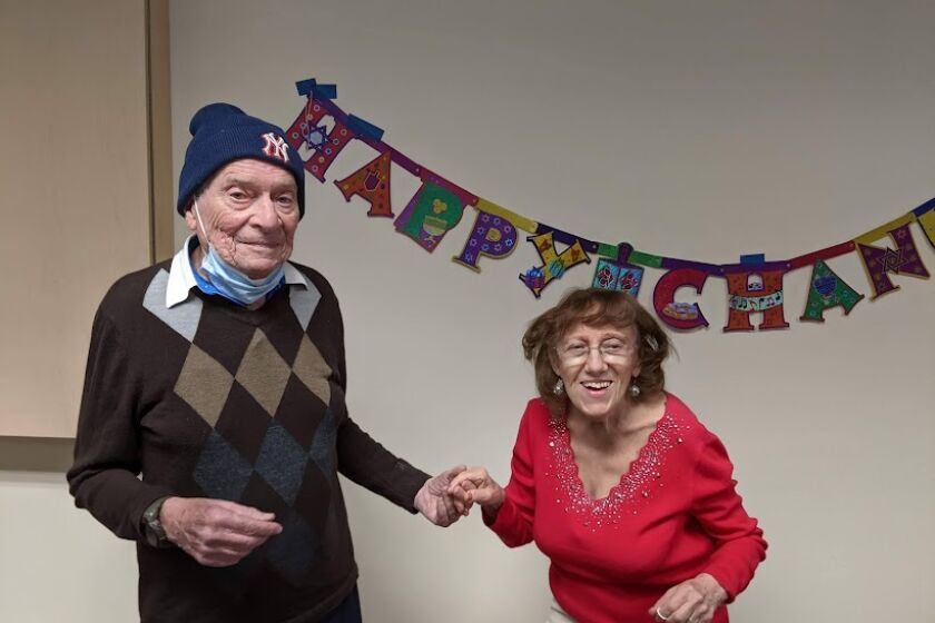 Harry and Frances Zimmerman show their dance moves at the Lawrence Family Jewish Community Center's Senior Hanukkah Party.
