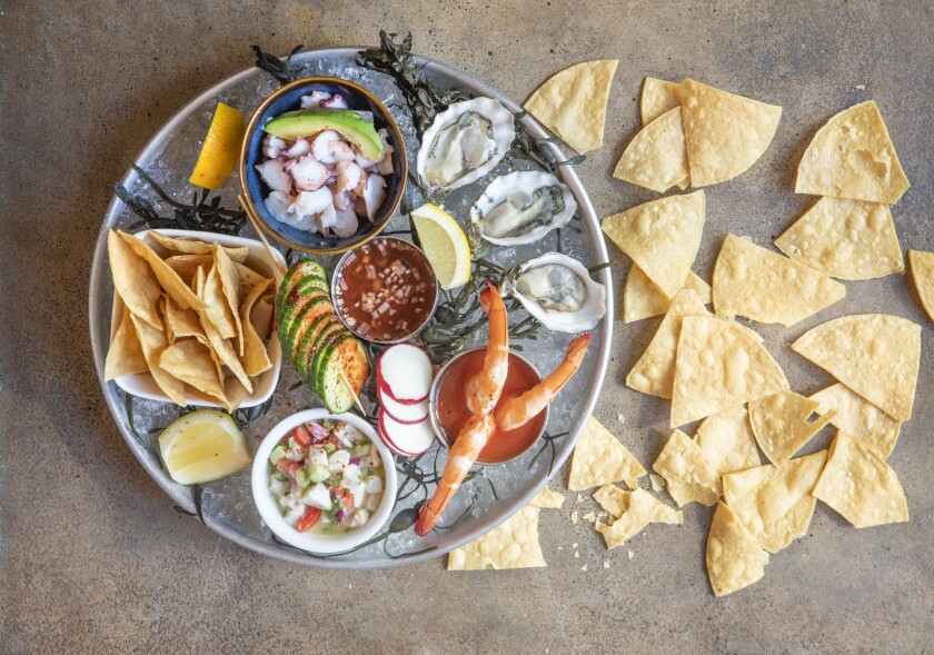 The Baja seafood platter with oysters, chipotle mignonette, ensalada mixta, Mexicali ceviche, shrimp campechana, seasonal veggies and tortilla chips from Socalo.
