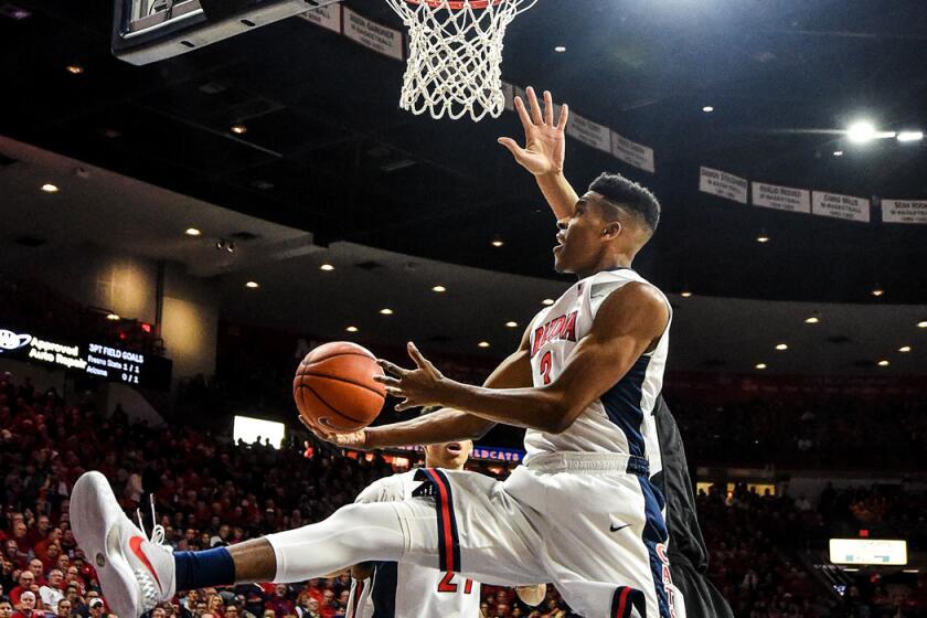 Arizona's Justin Smith shoots the ball during the first half of a game on Wednesday.