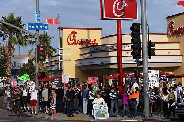 A group of gay-rights and same-sex marriage supporters protest in front of Chick-fil-A restaurant in Hollywood on Friday. LGBT supporters declared Friday to be National Same Sex Kiss Day and encouraged others to show up at Chick-fil-A restaurants nationwide to stage a "kiss-in."