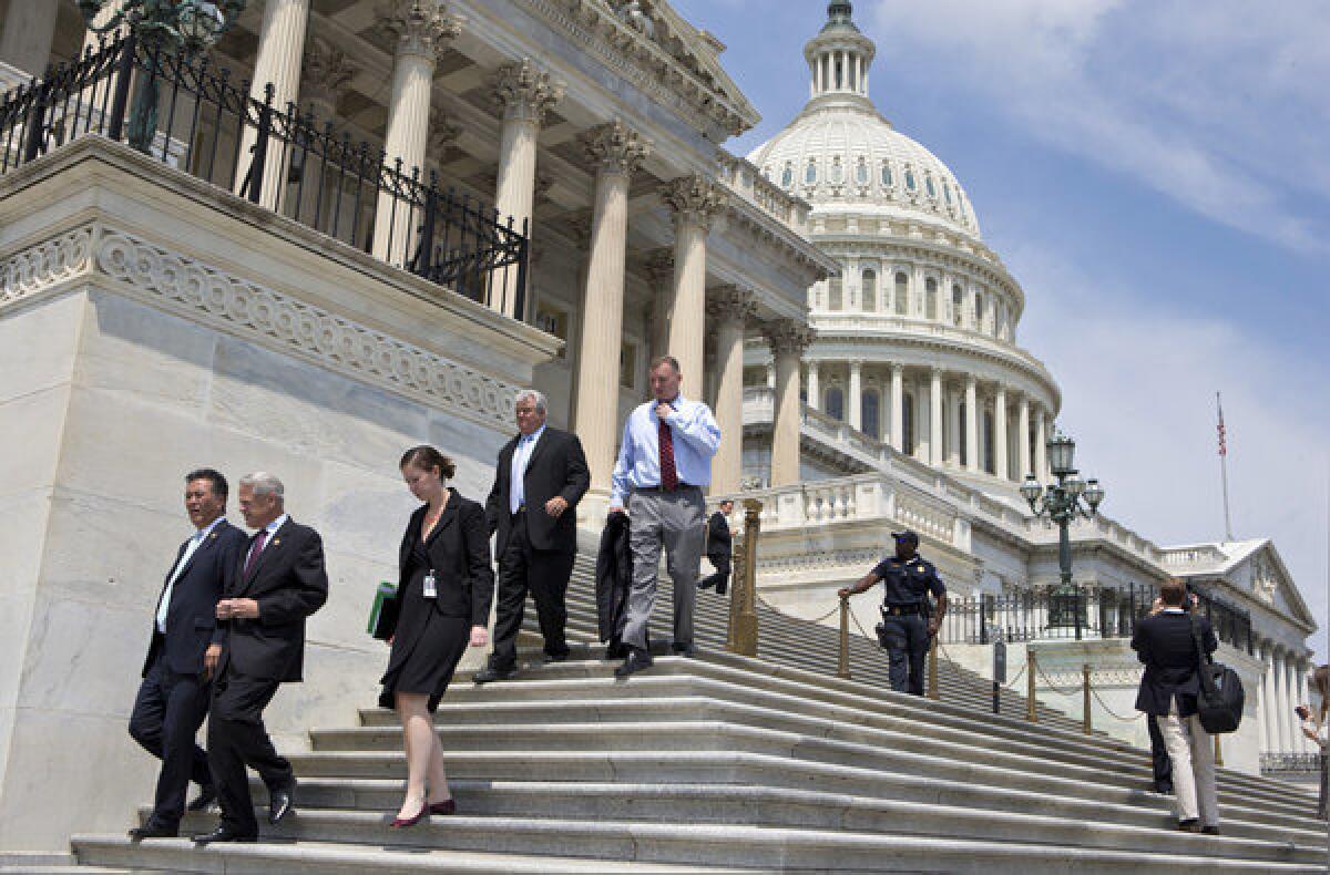 After final votes were cast, members of Congress walked down the steps of the House of Representatives on Capitol Hill in Washington as they left for a five-week recess.