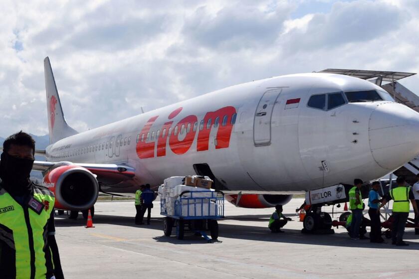 (FILES) In this file photo taken on October 10, 2018, a Lion Air Boeing 737 Max 800 aircraft is seen at the tarmac of the Mutiara Sis Al Jufri airport in Palu. - Indonesia's Lion Air said on March 12 that it was postponing the delivery of four Boeing 737 Max 8 jets after the Ethiopian Airlines crash and another deadly accident involving the same model near Jakarta in 2018. (Photo by ADEK BERRY / AFP)ADEK BERRY/AFP/Getty Images ** OUTS - ELSENT, FPG, CM - OUTS * NM, PH, VA if sourced by CT, LA or MoD **