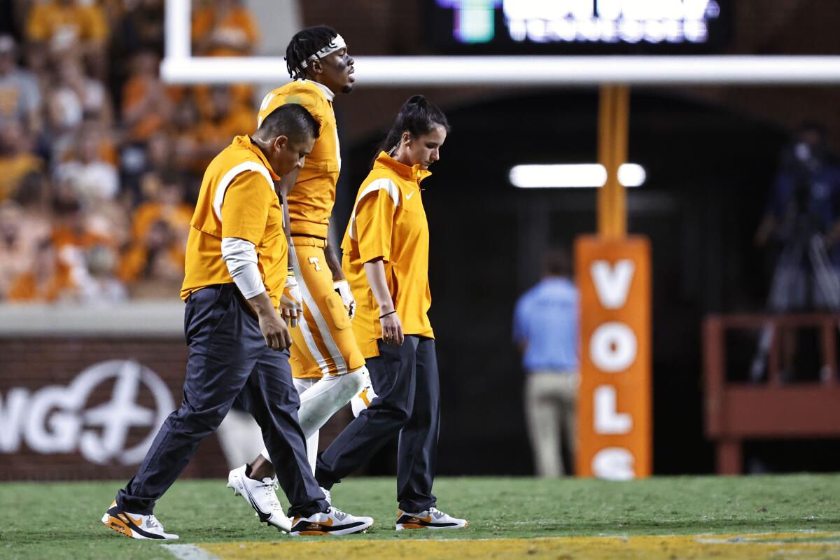 FILE - Tennessee wide receiver Cedric Tillman walks off the field after being injured during the first half of an NCAA college football game against Akron on Sept. 17, 2022, in Knoxville, Tenn. Tennessee coach Josh Heupel said Monday, Oct. 3, that Tillman had surgery on his left ankle to speed up recovery from an injury. (AP Photo/Wade Payne, File)