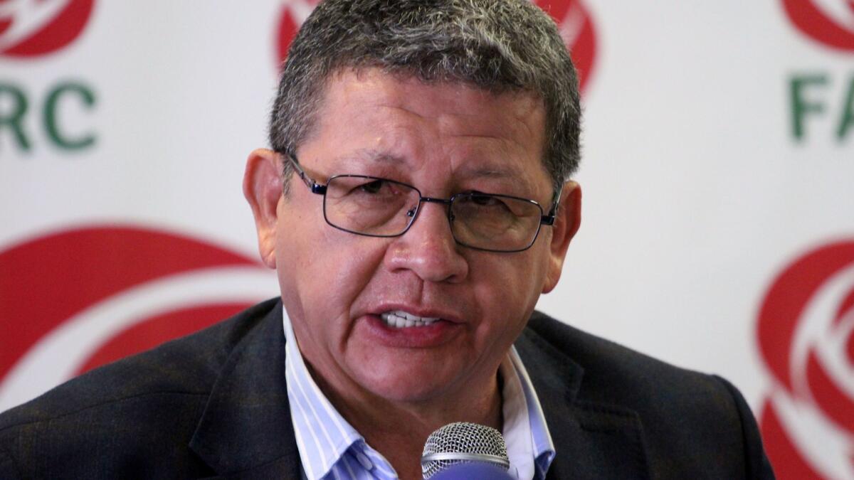 Pablo Catatumbo, a member of the Common Alternative Revolutionary Force political party, or FARC, speaks during a news conference in Bogota on Feb. 9 in which the party announced it was suspending its electoral campaign.