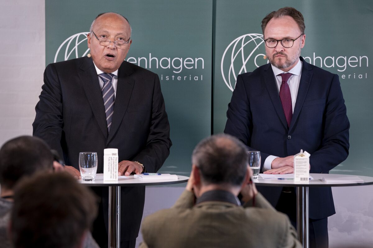 Egyptian foreign minister Sameh Shoukry, left, and Denmark's climate minister, Dan Joergensen speak during a press conference at the Copenhagen Climate Ministerial, in Copenhagen, Tuesday, March 21, 2023. Senior government officials gathered for a climate meeting in Copenhagen gave a muted response Tuesday to calls from the head of the United Nations for countries to show greater ambition when it comes to reducing greenhouse gas emissions. (Liselotte Sabroe/Ritzau Scanpix via AP)